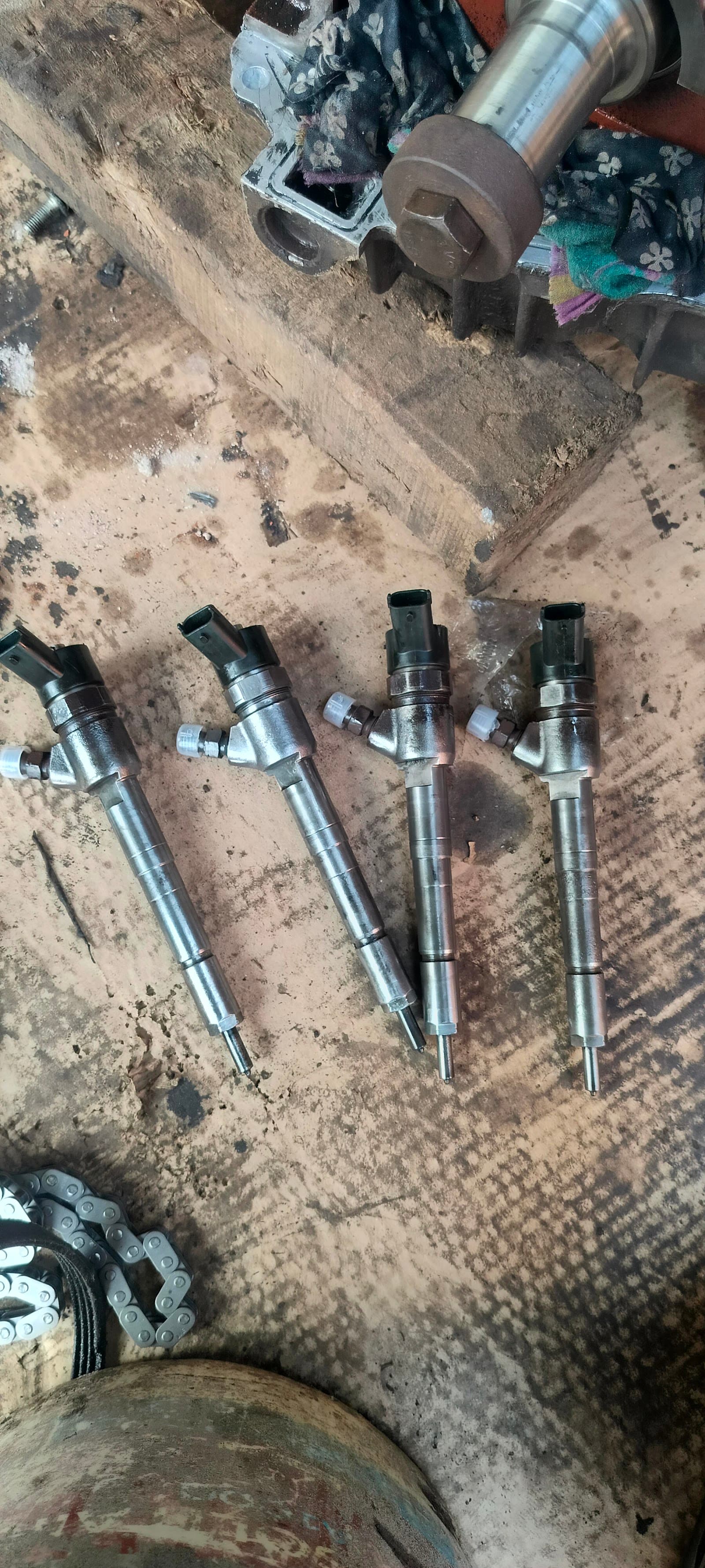 Four diesel injectors removed for testing
