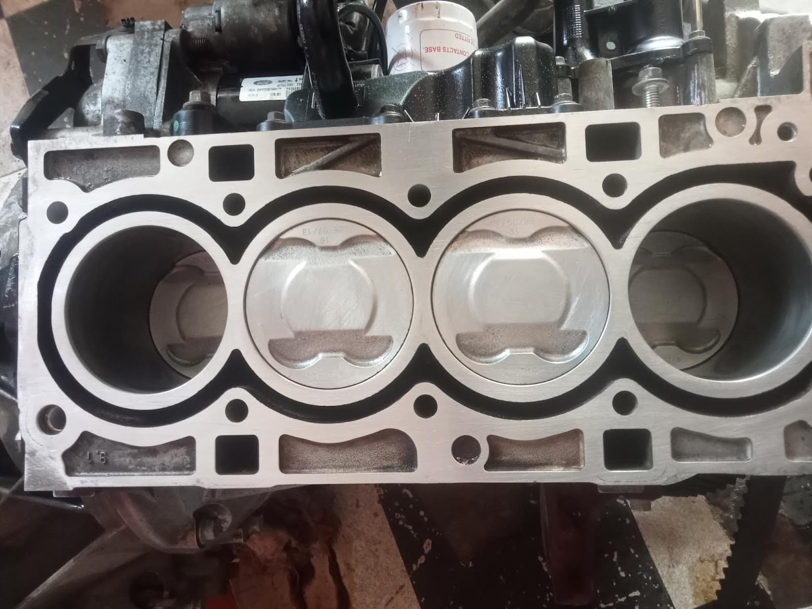 Pistons seated in a cleaned engine block