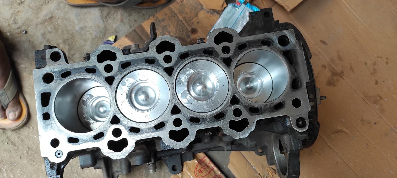 Engine block with four new pistons fitted